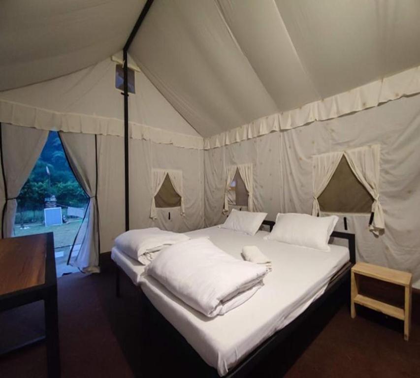 Postel nebo postele na pokoji v ubytování Glampers Resort