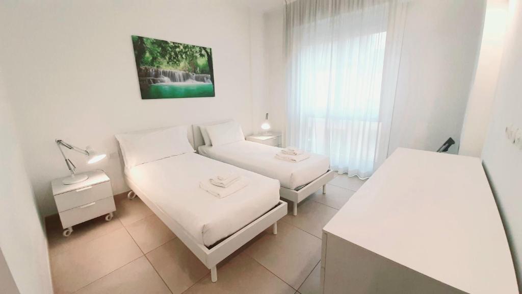 A bed or beds in a room at UR-NEST Galleria del Toro