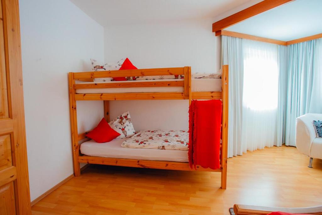 A bed or beds in a room at Appartement ERIKA by MoniCare (Haus Claudia)