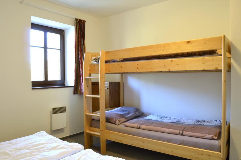 Postel nebo postele na pokoji v ubytování Stavěnka Kunčice