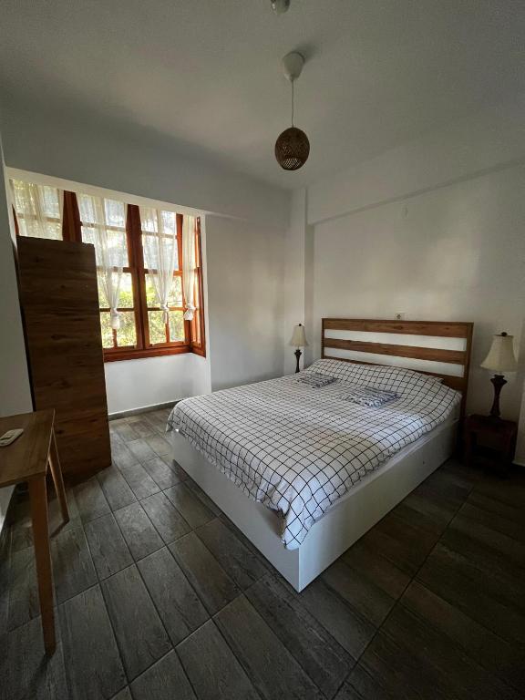 Postel nebo postele na pokoji v ubytování Kuyu Beergarden Hostel