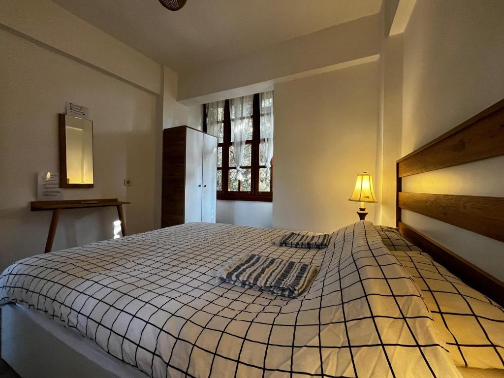 Postel nebo postele na pokoji v ubytování Kuyu Beergarden Hostel