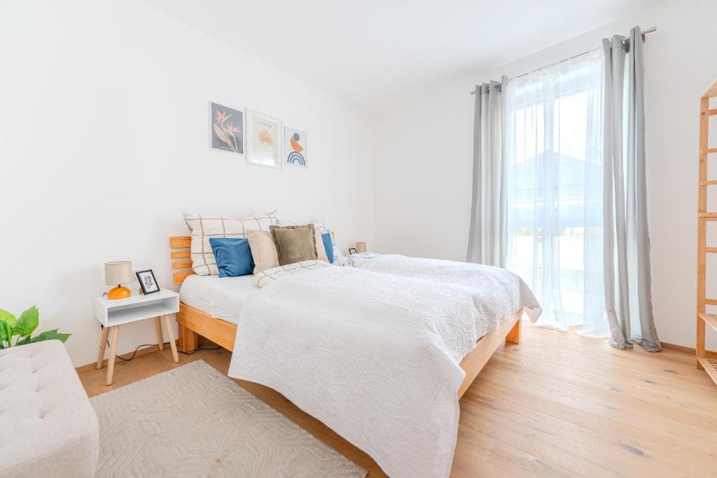 Postel nebo postele na pokoji v ubytování Gneixendorf Exclusive Apartments
