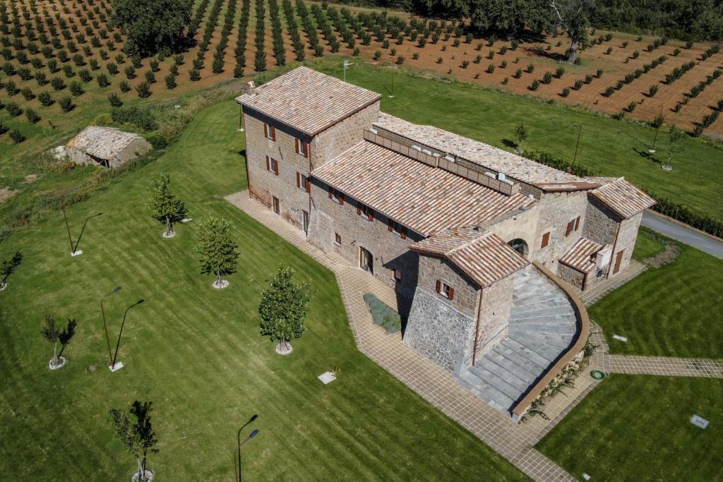 an aerial view of a large building in a field at Agriturismo Santa Rosa in Lubriano