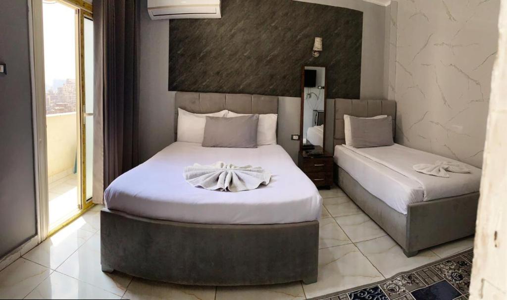 Postel nebo postele na pokoji v ubytování NADA - HOTEl