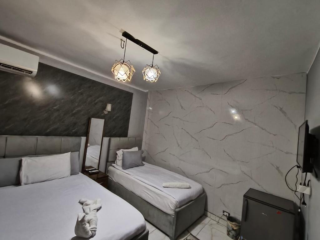 Postel nebo postele na pokoji v ubytování NADA - HOTEl