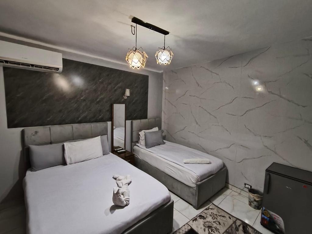 Postel nebo postele na pokoji v ubytování NADA - HOTEl