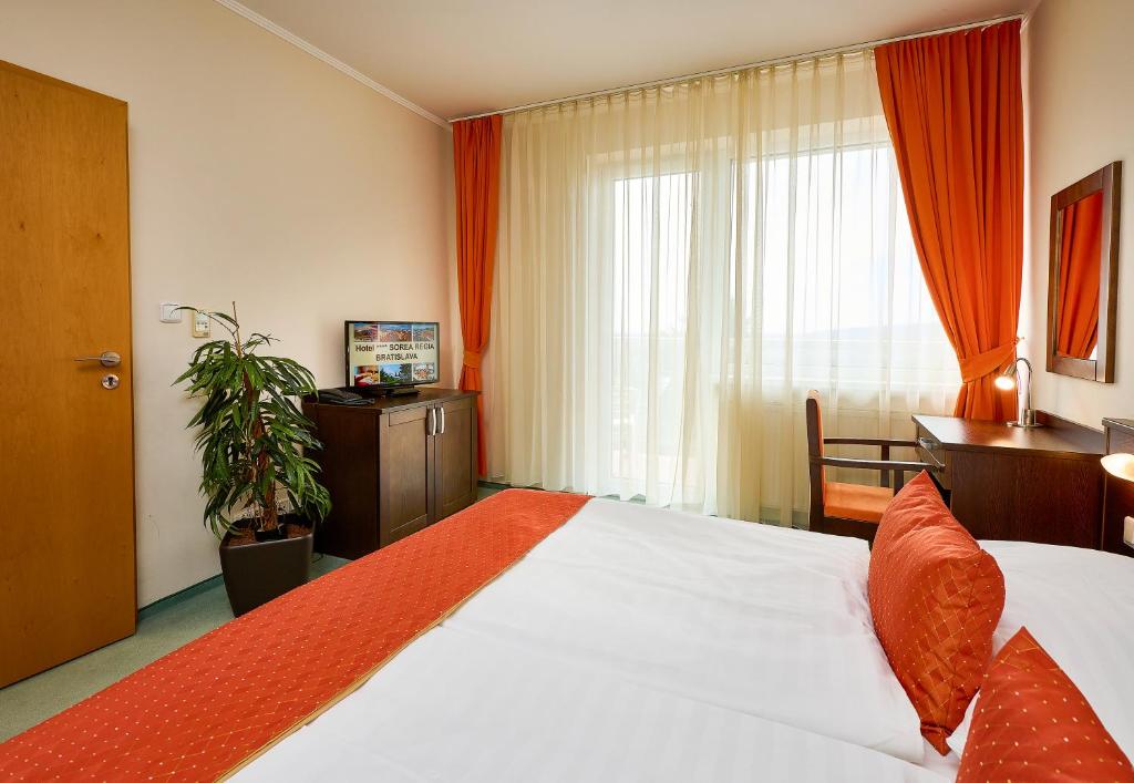 Postel nebo postele na pokoji v ubytování Hotel SOREA REGIA