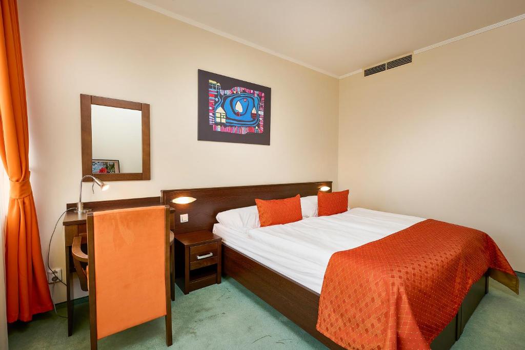 Postel nebo postele na pokoji v ubytování Hotel SOREA REGIA