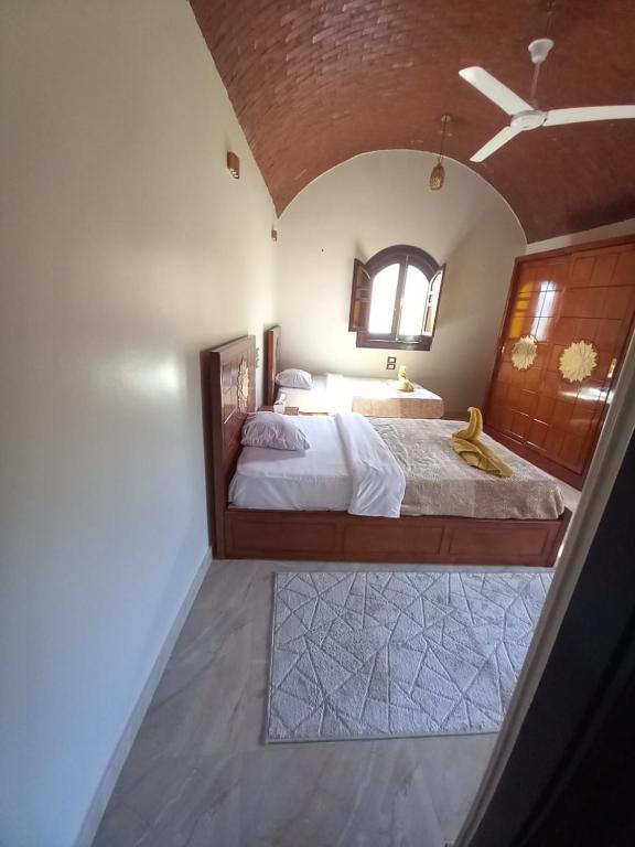 Rúm í herbergi á Nubian Soul Guest Houses