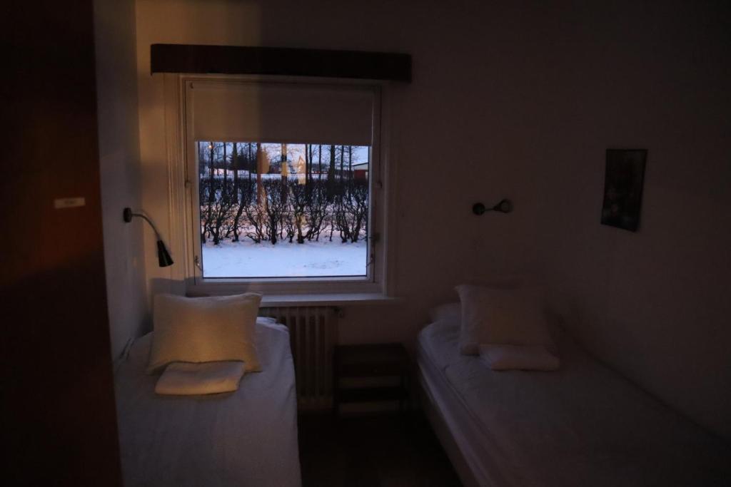 Postel nebo postele na pokoji v ubytování Spói Guesthouse