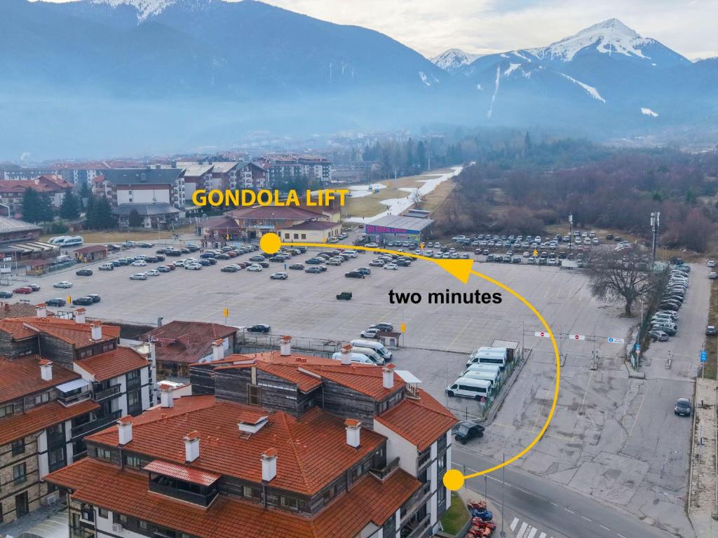 an aerial view of a parking lot with two min vehicles at Great location near lift in Bansko