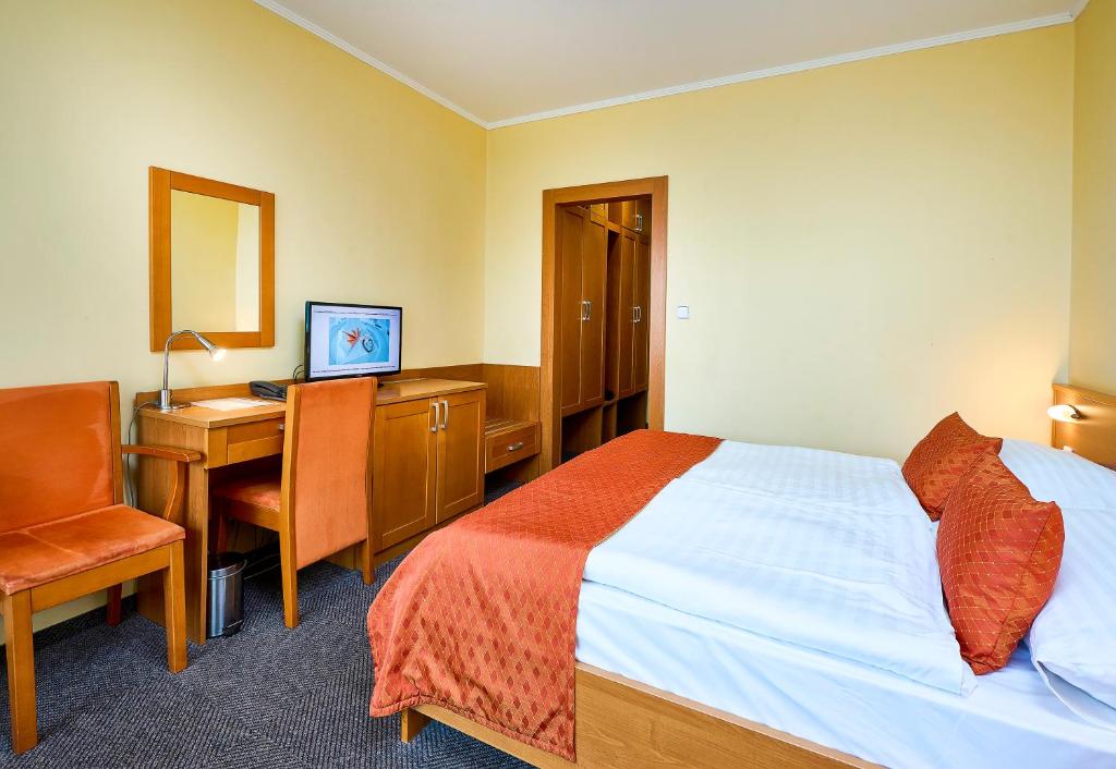 Postel nebo postele na pokoji v ubytování Hotel SOREA REGIA