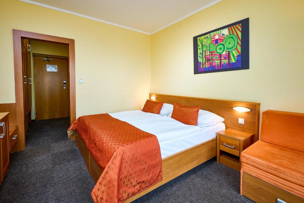 Postel nebo postele na pokoji v ubytování Hotel SOREA REGIA