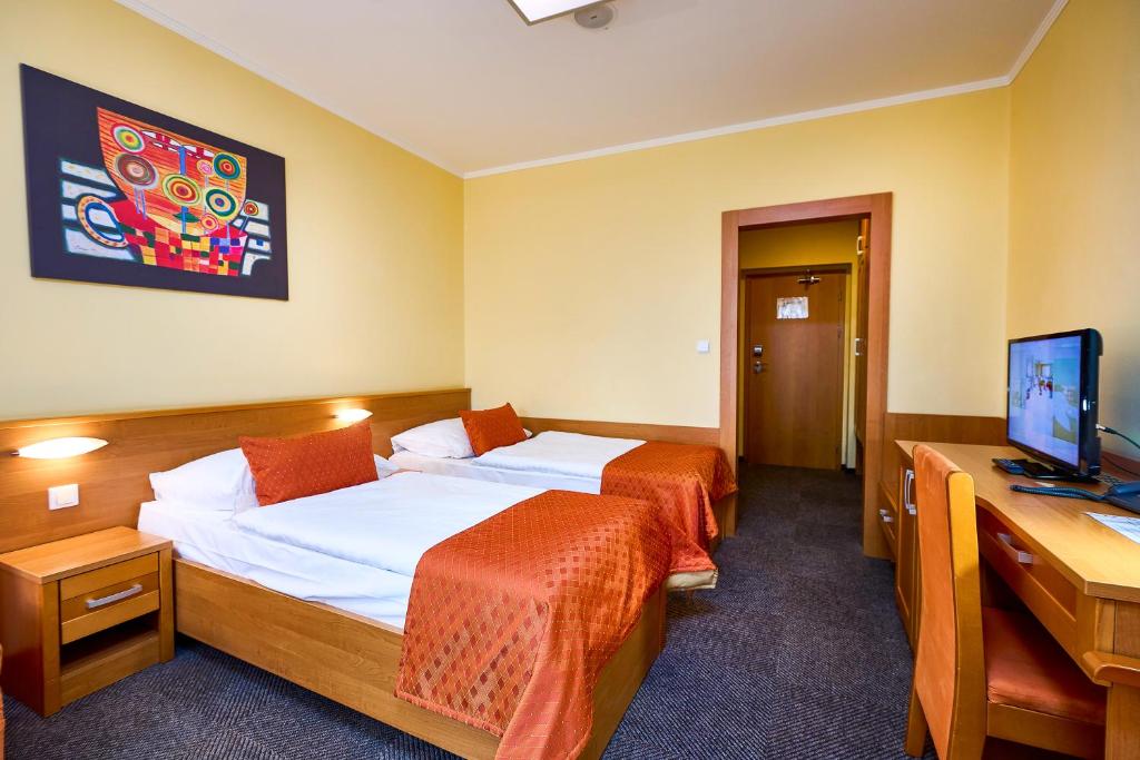 Postel nebo postele na pokoji v ubytování Hotel SOREA REGIA