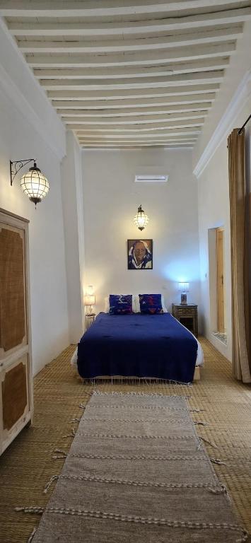 Postel nebo postele na pokoji v ubytování La Maison des Amis