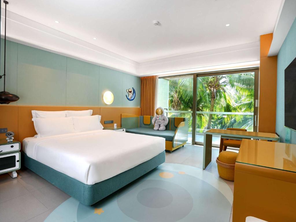 Postel nebo postele na pokoji v ubytování Pullman Oceanview Sanya Bay Resort & Spa