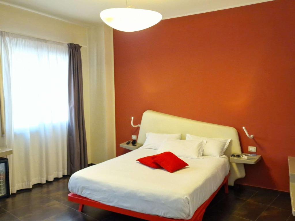 Postel nebo postele na pokoji v ubytování Ibis Styles Palermo President