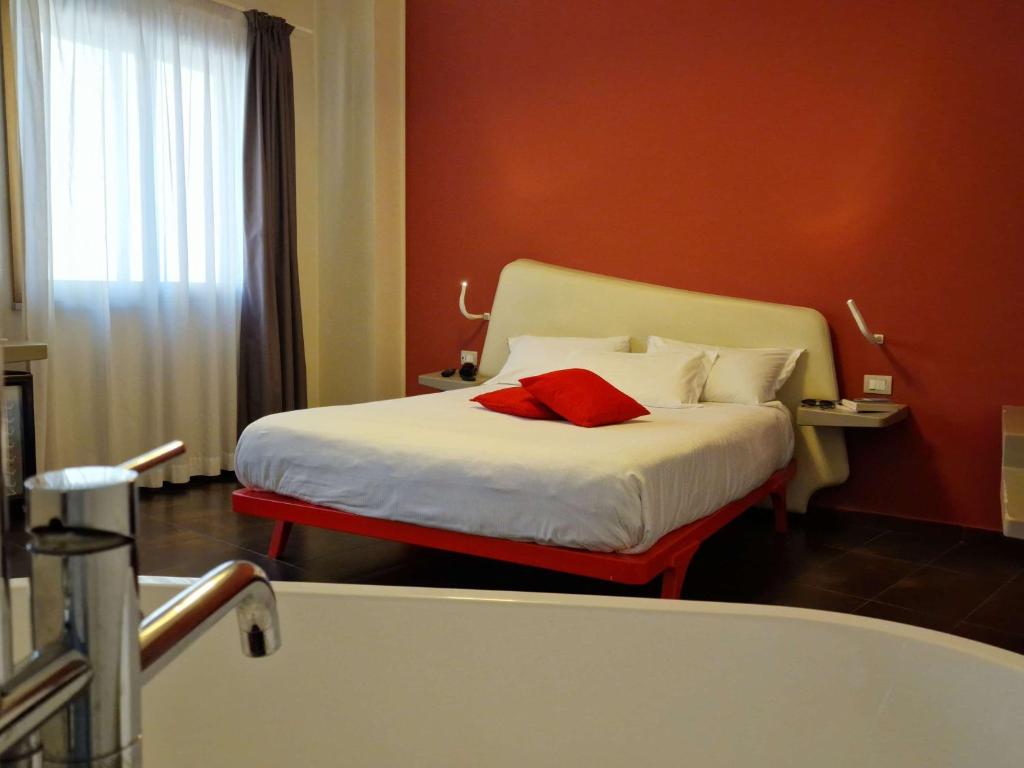 Postel nebo postele na pokoji v ubytování Ibis Styles Palermo President