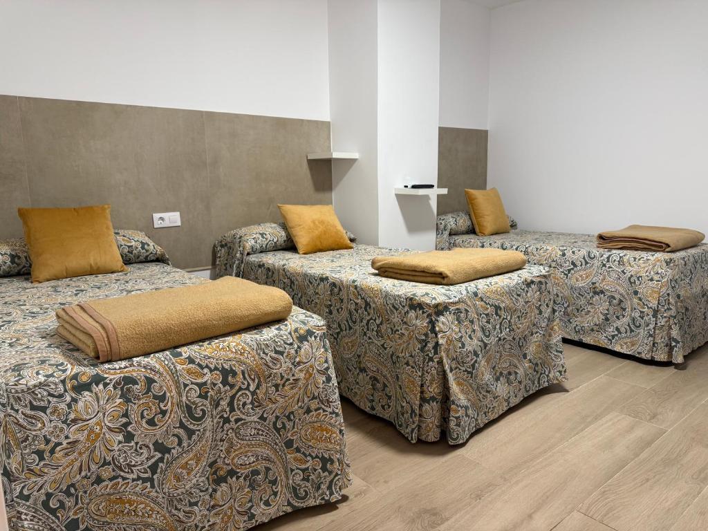 Postel nebo postele na pokoji v ubytování Hotel Quitagolpe