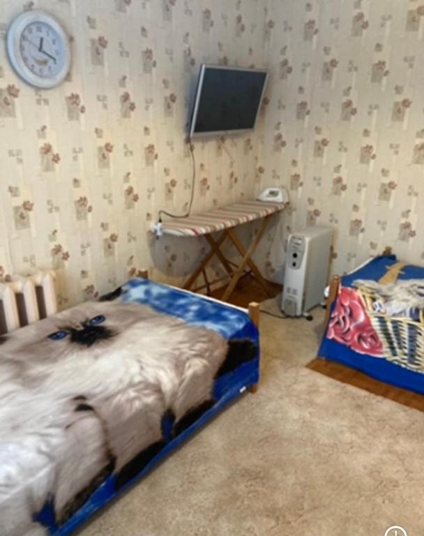 Postel nebo postele na pokoji v ubytování Квартира недалеко от погранпункта