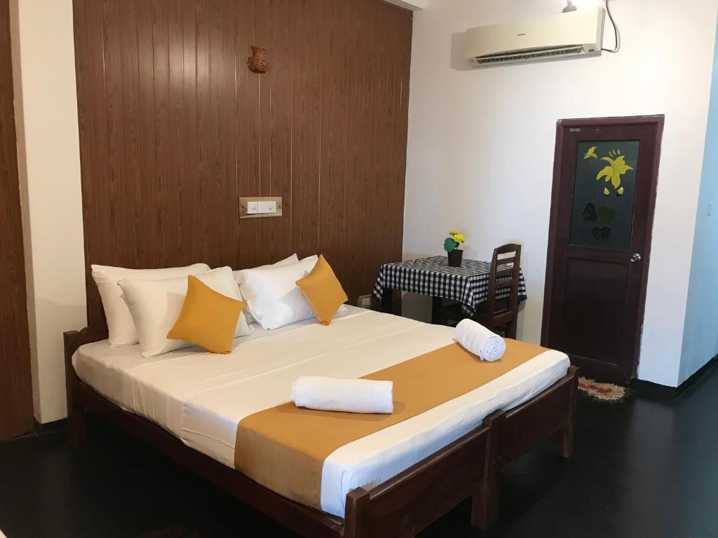 Ένα ή περισσότερα κρεβάτια σε δωμάτιο στο Sunray Beach House