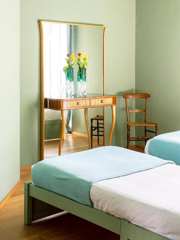A bed or beds in a room at Domus Plinii 1792 Suites