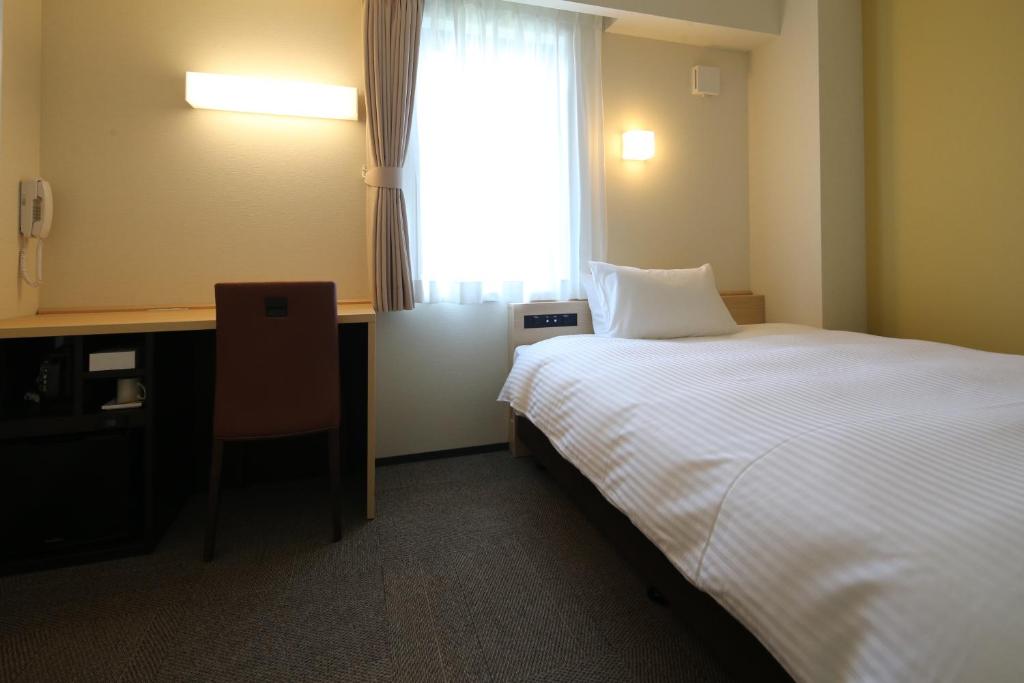 Postel nebo postele na pokoji v ubytování AB Hotel Seki