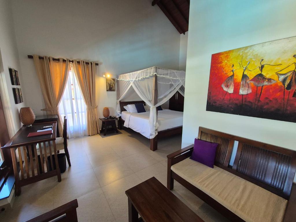 Postel nebo postele na pokoji v ubytování IMAGINE Villa Hotel