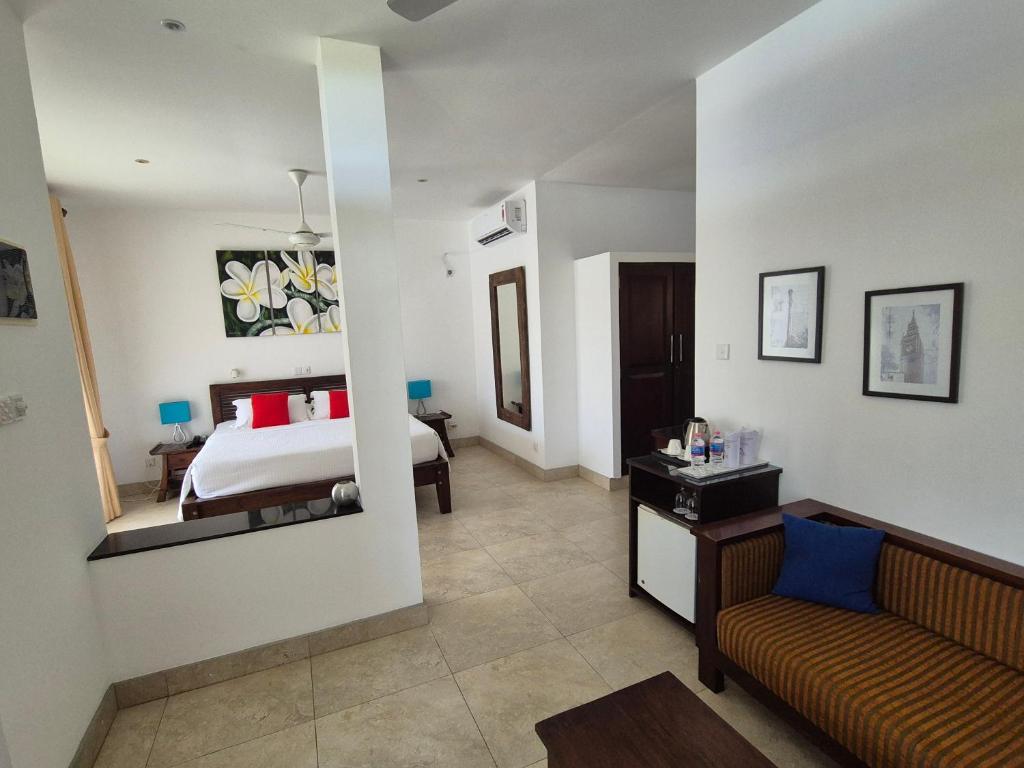 Postel nebo postele na pokoji v ubytování IMAGINE Villa Hotel