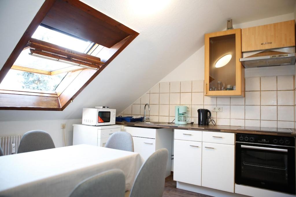 Η κουζίνα ή μικρή κουζίνα στο 4-Zimmer-Wohnung Ettenheim