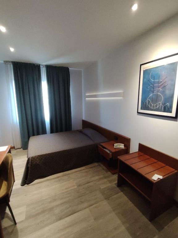 Posteľ alebo postele v izbe v ubytovaní Albergo Centrale