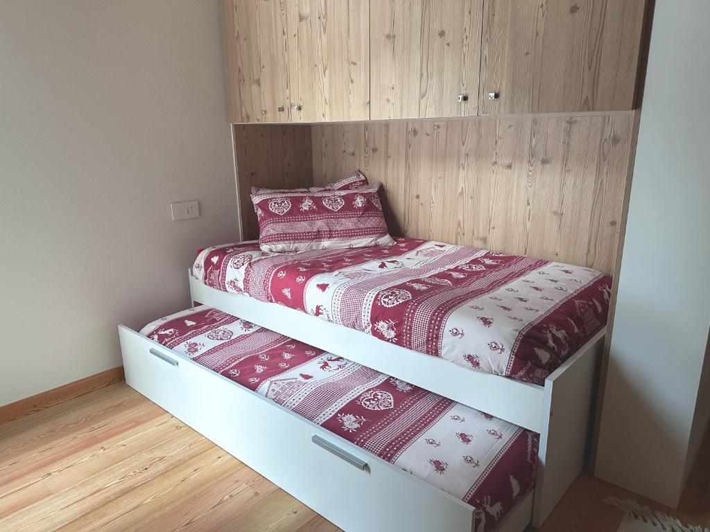 Postel nebo postele na pokoji v ubytování Chalet immerso nel verde