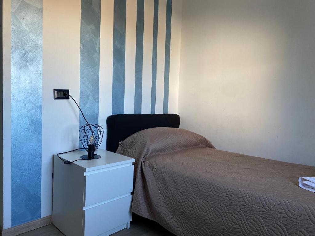 Postel nebo postele na pokoji v ubytování NONE Holiday HOTEL
