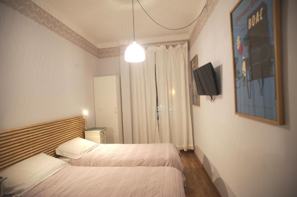 Łóżko lub łóżka w pokoju w obiekcie Bernini apartment