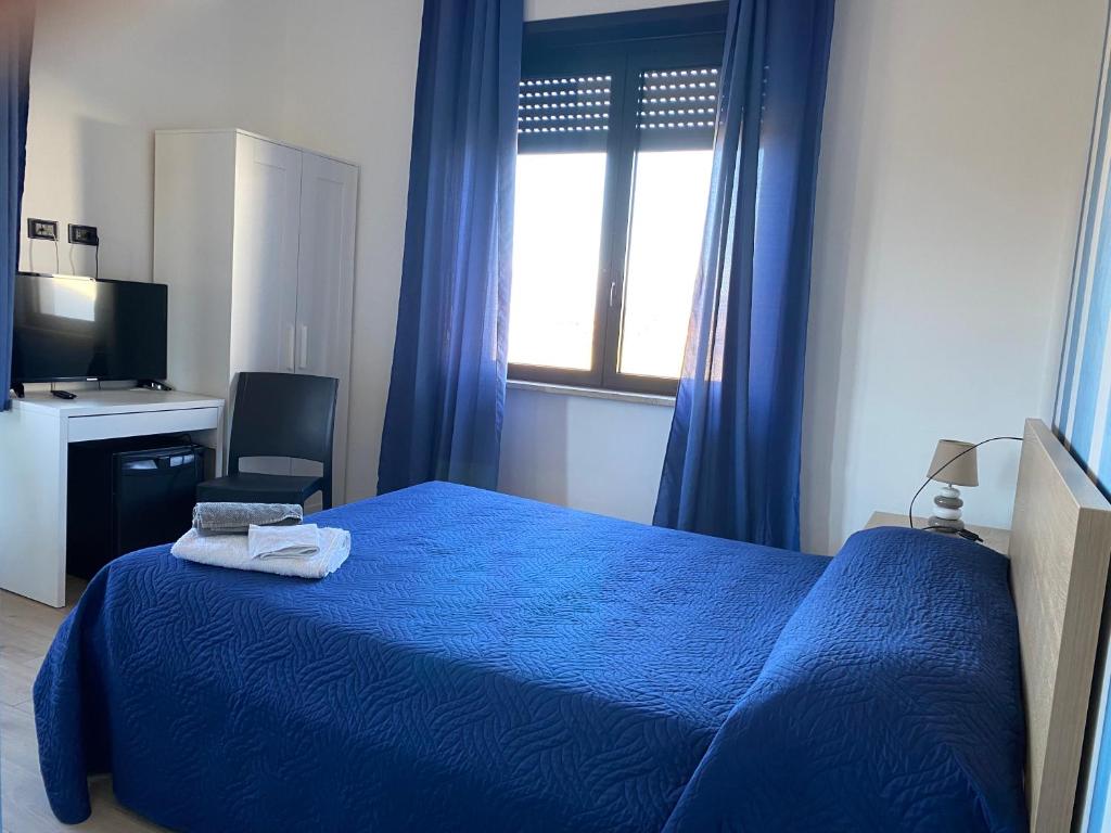 Postel nebo postele na pokoji v ubytování NONE Holiday HOTEL