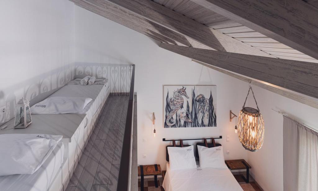 Postel nebo postele na pokoji v ubytování Mirsini Studios & Apartments