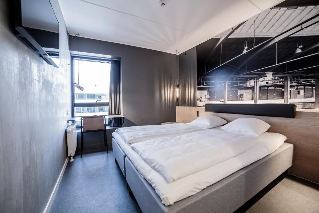 Uma cama ou camas num quarto em Four Points Flex by Sheraton Aalborg