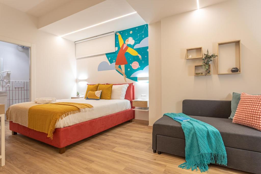 Postel nebo postele na pokoji v ubytování Le Muse Suites