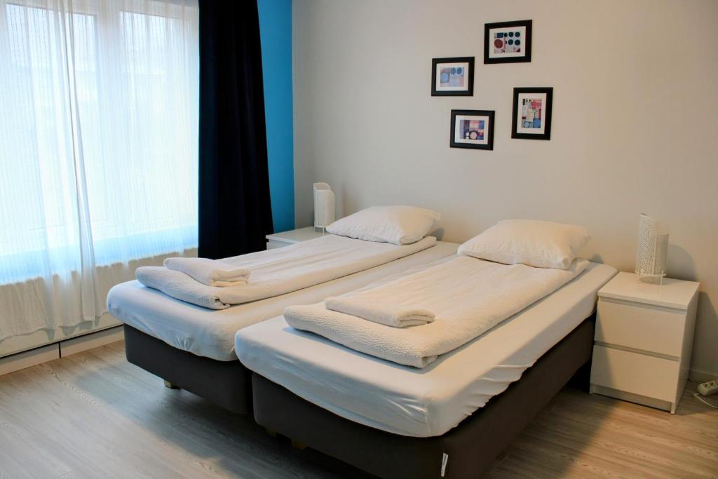 Postel nebo postele na pokoji v ubytování Green House Apartments