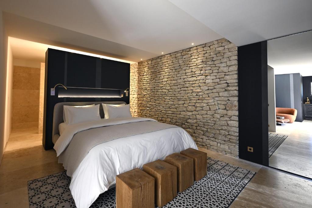 Postel nebo postele na pokoji v ubytování La Suite Gordes