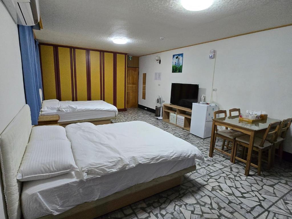 Postel nebo postele na pokoji v ubytování 高鐵中彰309民宿