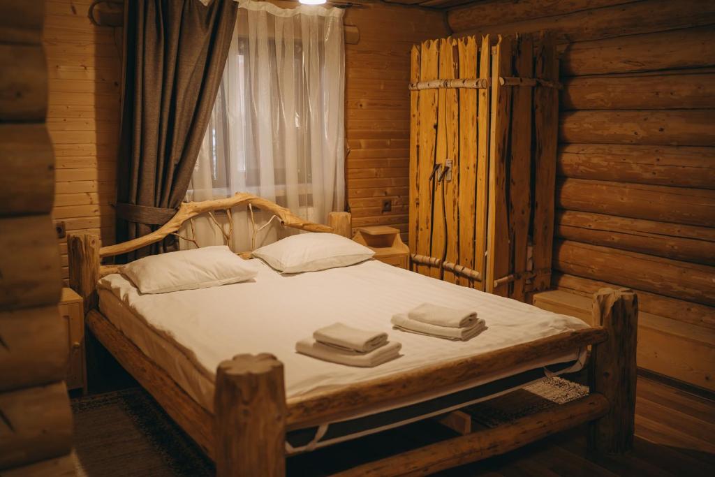 Postel nebo postele na pokoji v ubytování Kisva Hotel