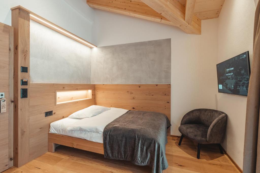Postel nebo postele na pokoji v ubytování Hotel Porta Cervino