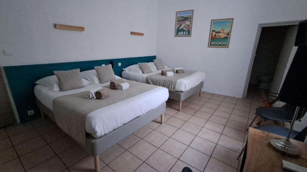 Postel nebo postele na pokoji v ubytování Hôtel L'Herbier d'Orange