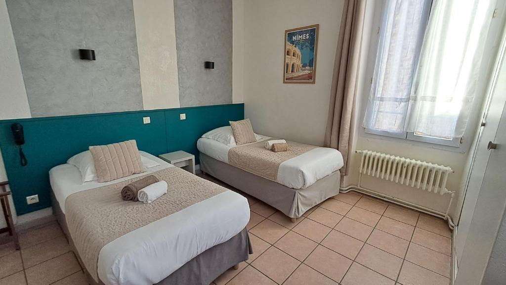 Postel nebo postele na pokoji v ubytování Hôtel L'Herbier d'Orange