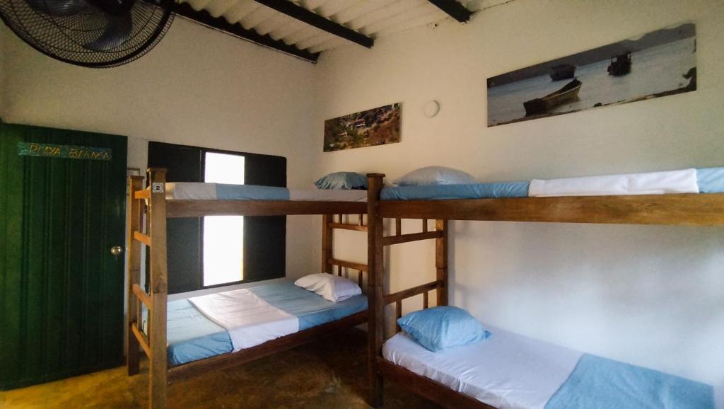 Postel nebo postele na pokoji v ubytování Villa Mary Hostel