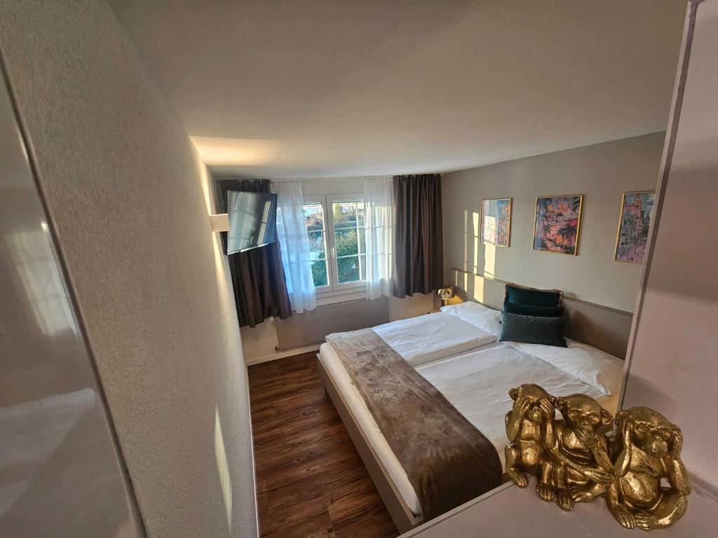 Postel nebo postele na pokoji v ubytování Apart-Hôtel Pont-de-Thielle