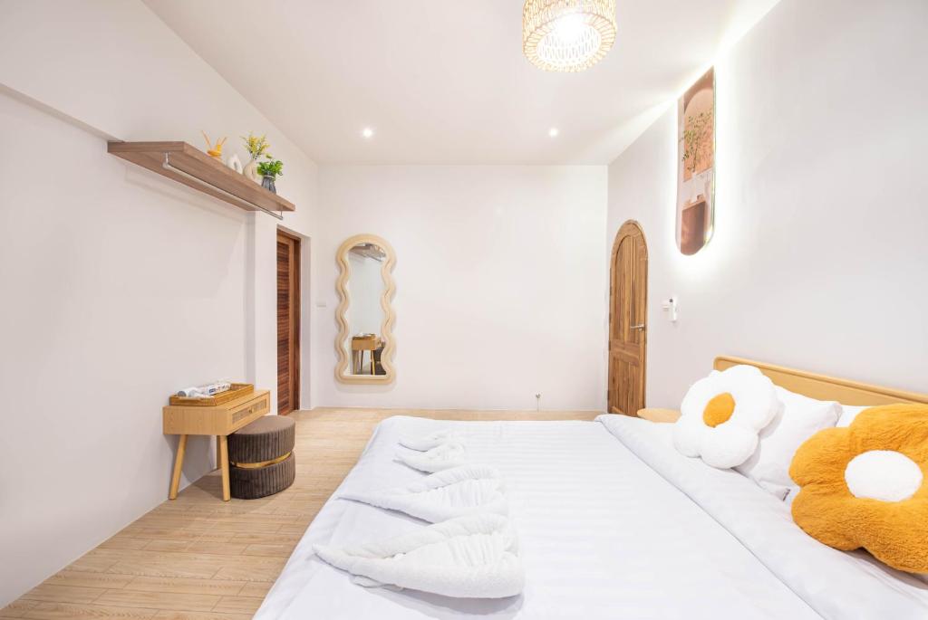 Postel nebo postele na pokoji v ubytování De Beach pool villa เดิน 3 นาทีจากชายหาด