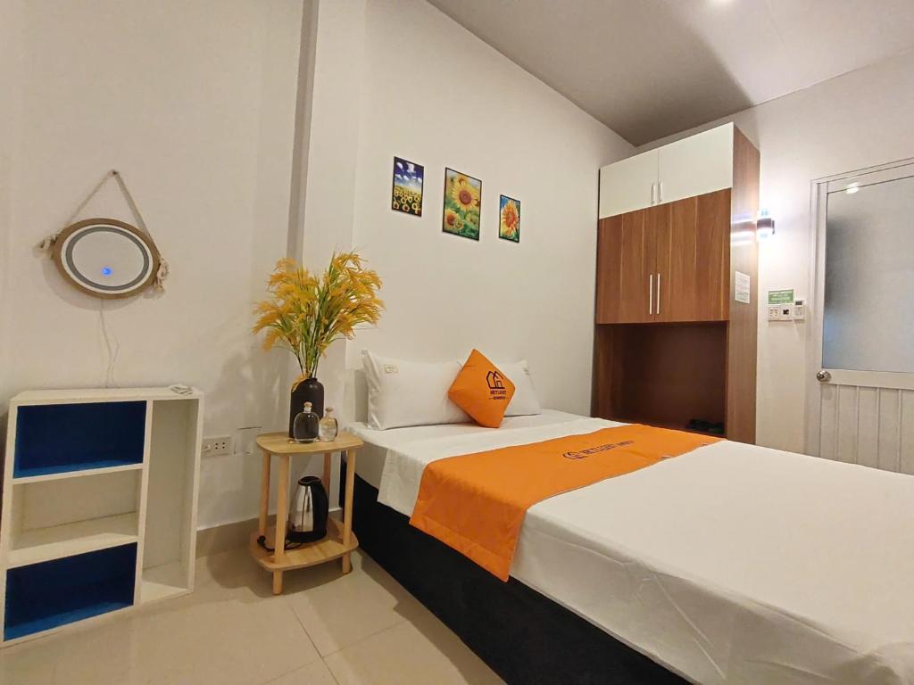 Postel nebo postele na pokoji v ubytování Skylight Homestay